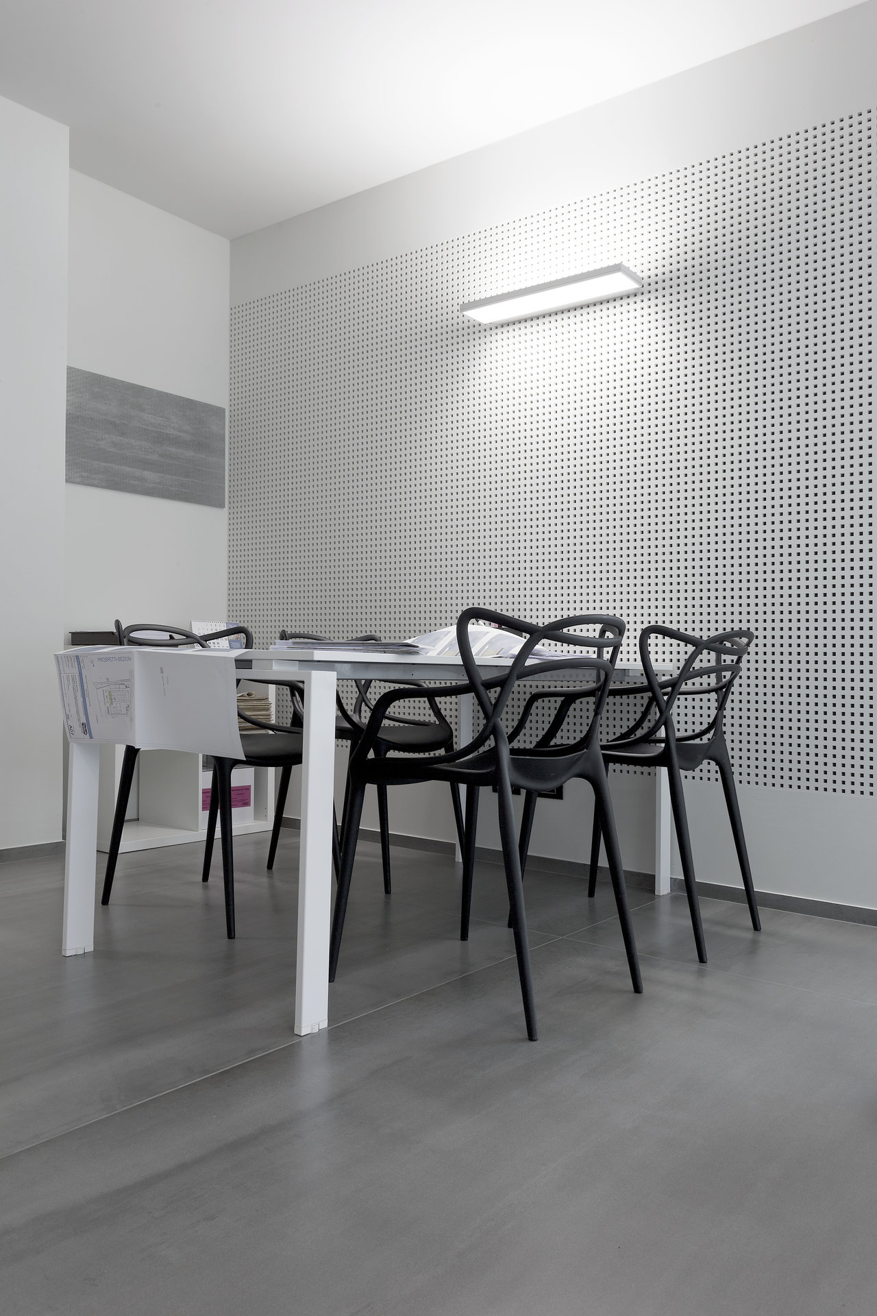 Large-format grey floor tiles in a modern room.