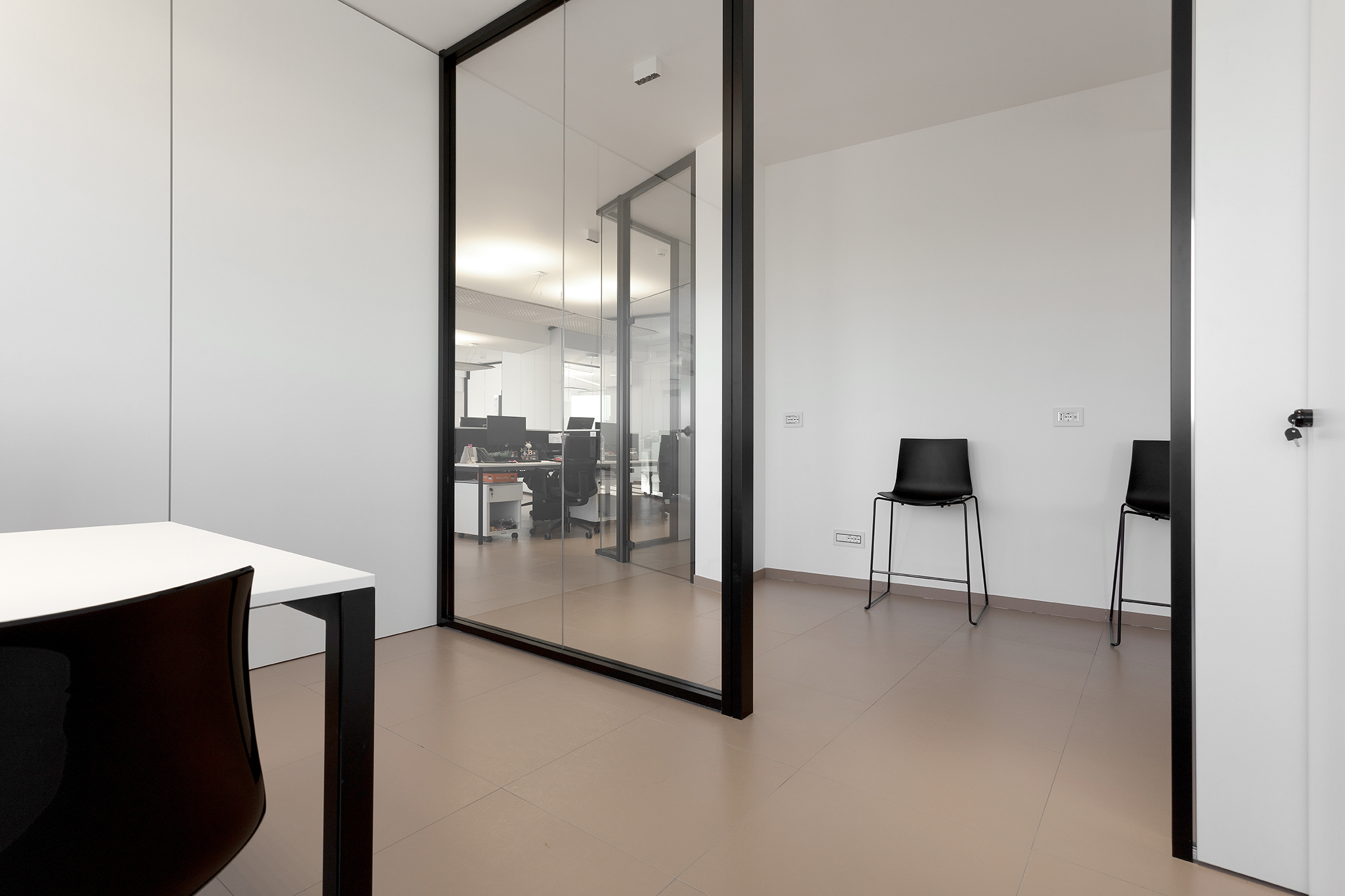 High-quality floor tiles in light beige in a modern office space.