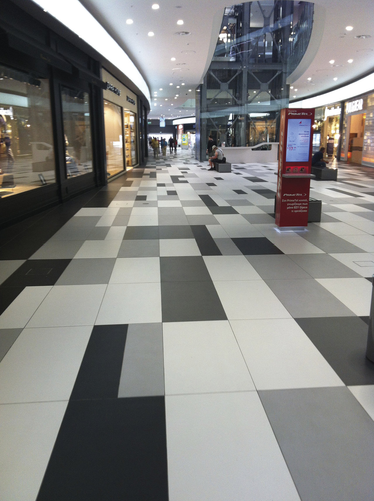 Design tiles in black, grey, and white with a modern, geometric pattern.