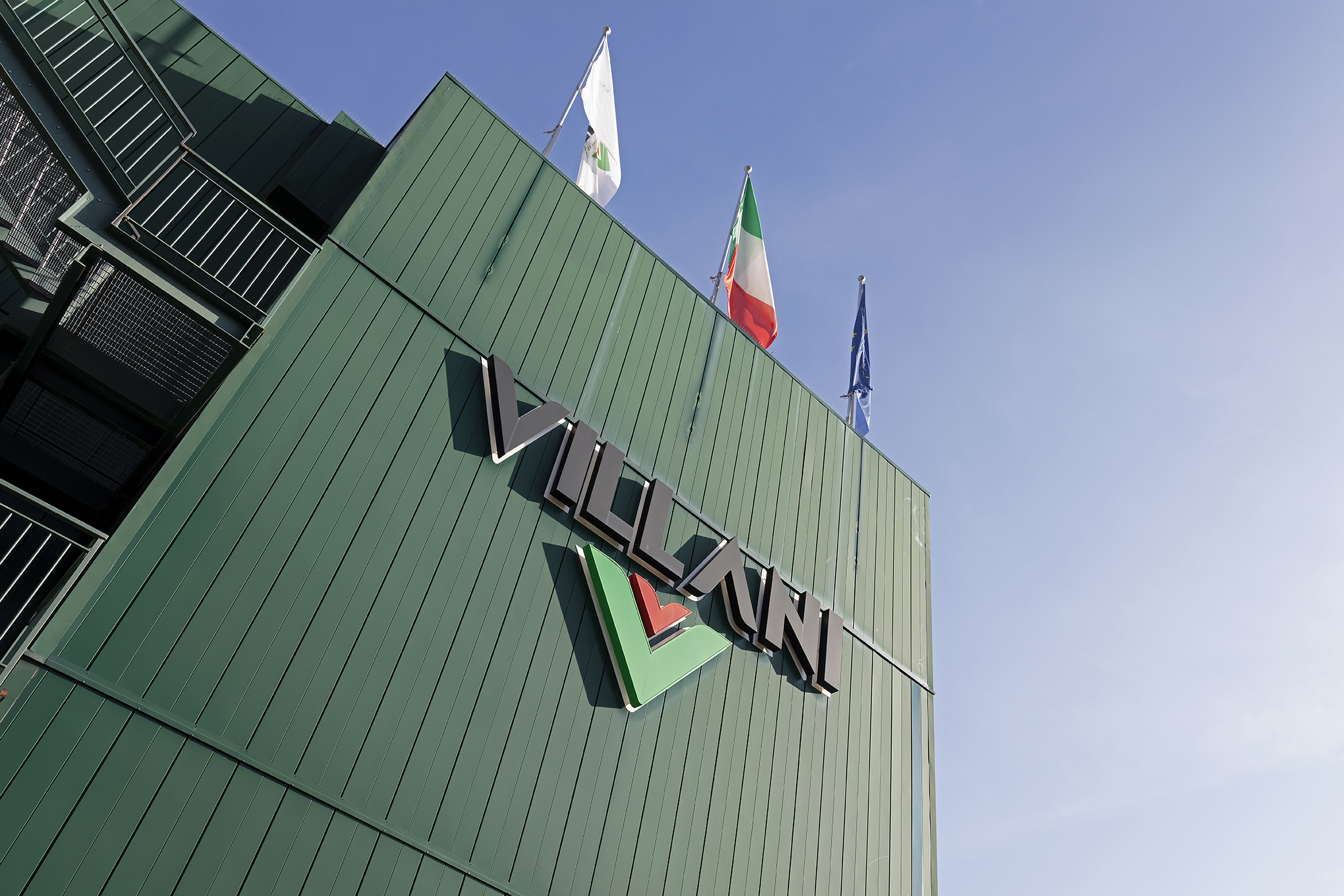 VILLANI company building with Italian flag. A partner for high-quality tiles.