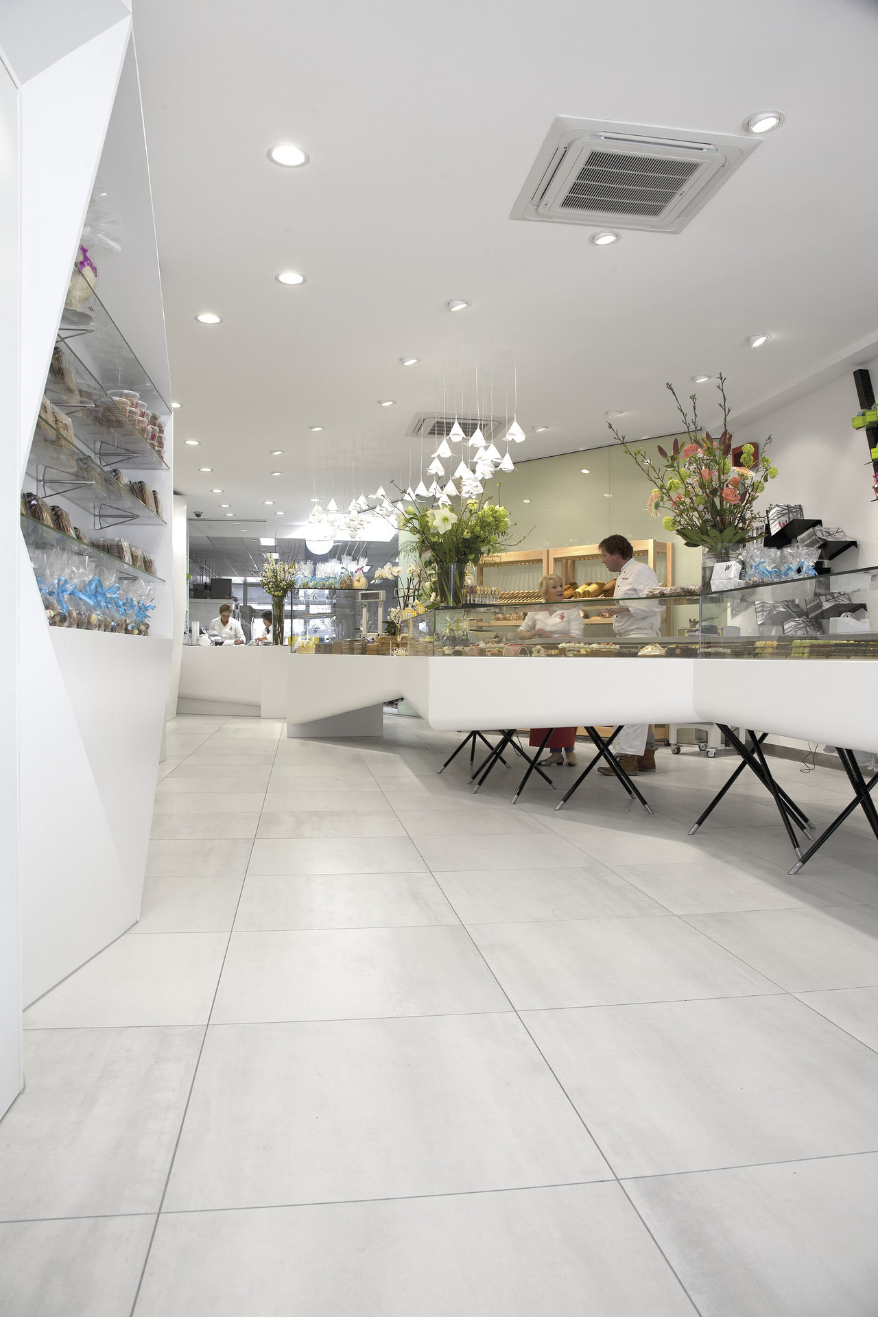 Light porcelain tiles in modern shop design.