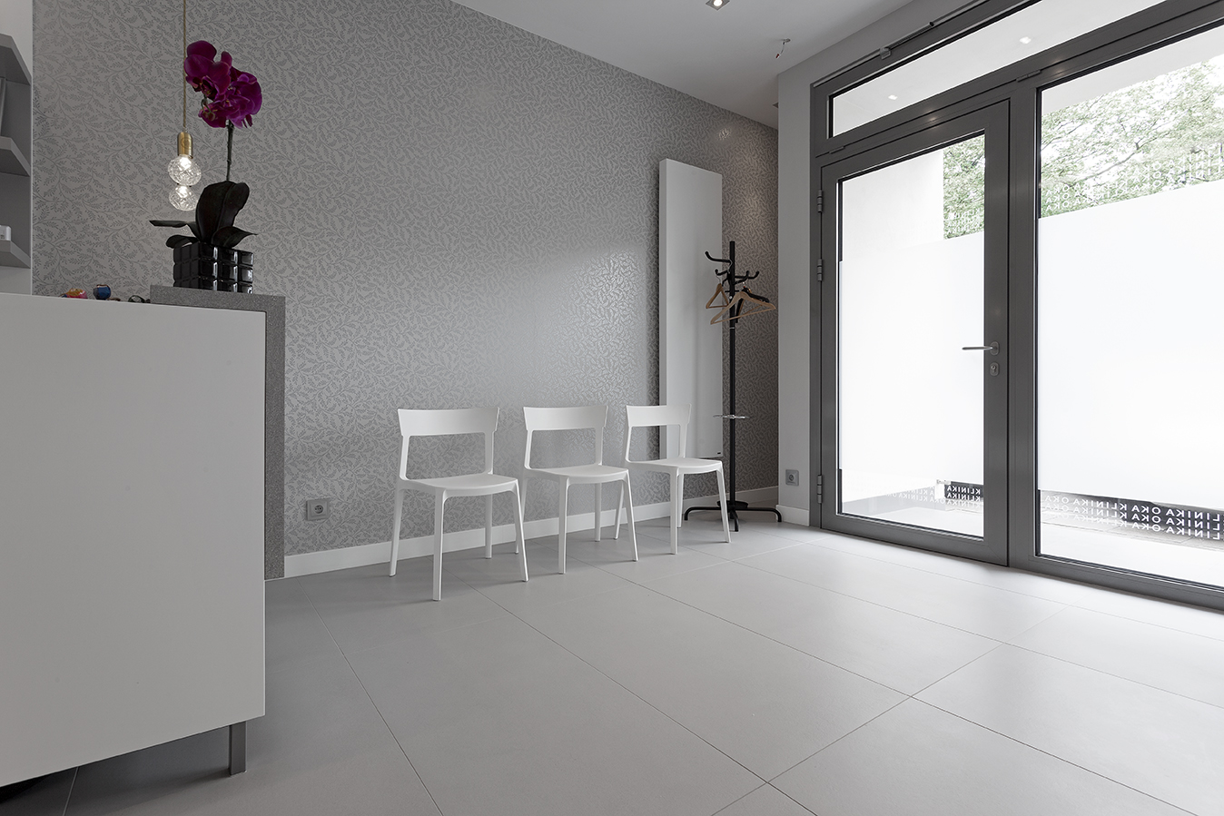 Large-format light grey floor tiles for modern interiors.