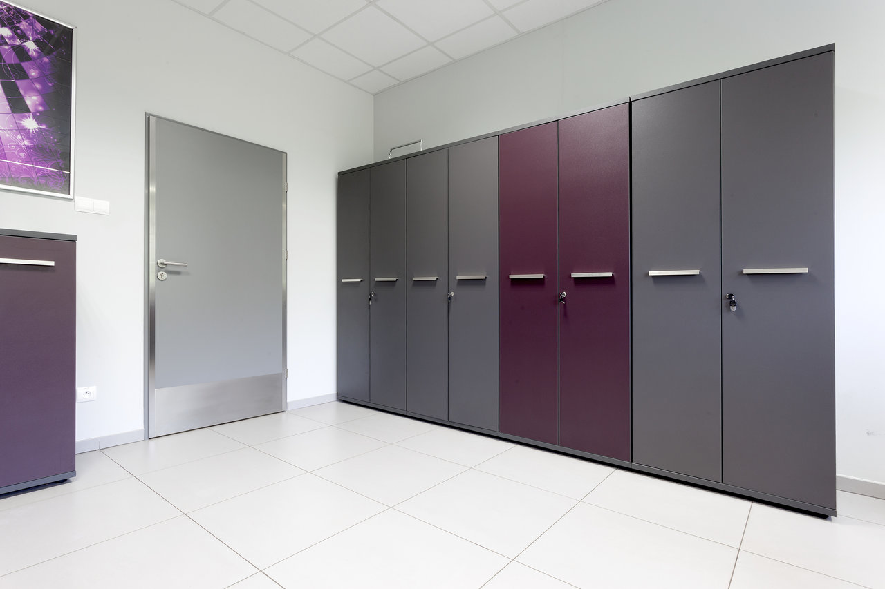 Light, large-format floor tiles in a modern interior.