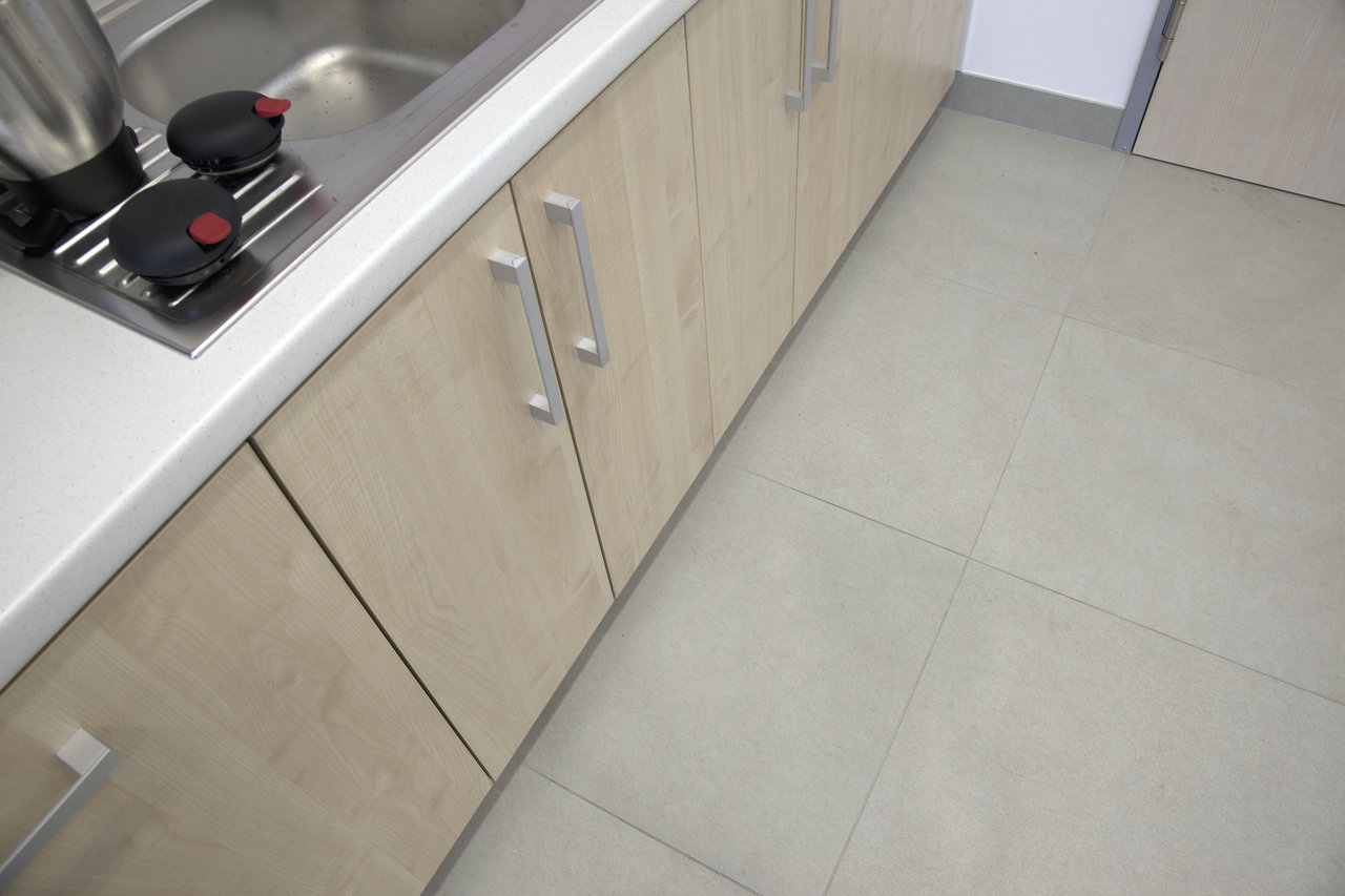 Large-format, light-grey tiles for modern interiors.