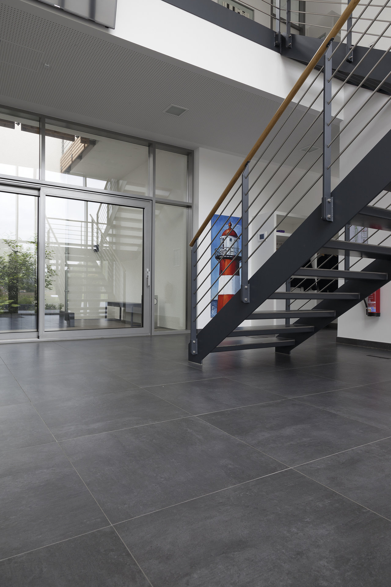 Large-format anthracite indoor tiles.