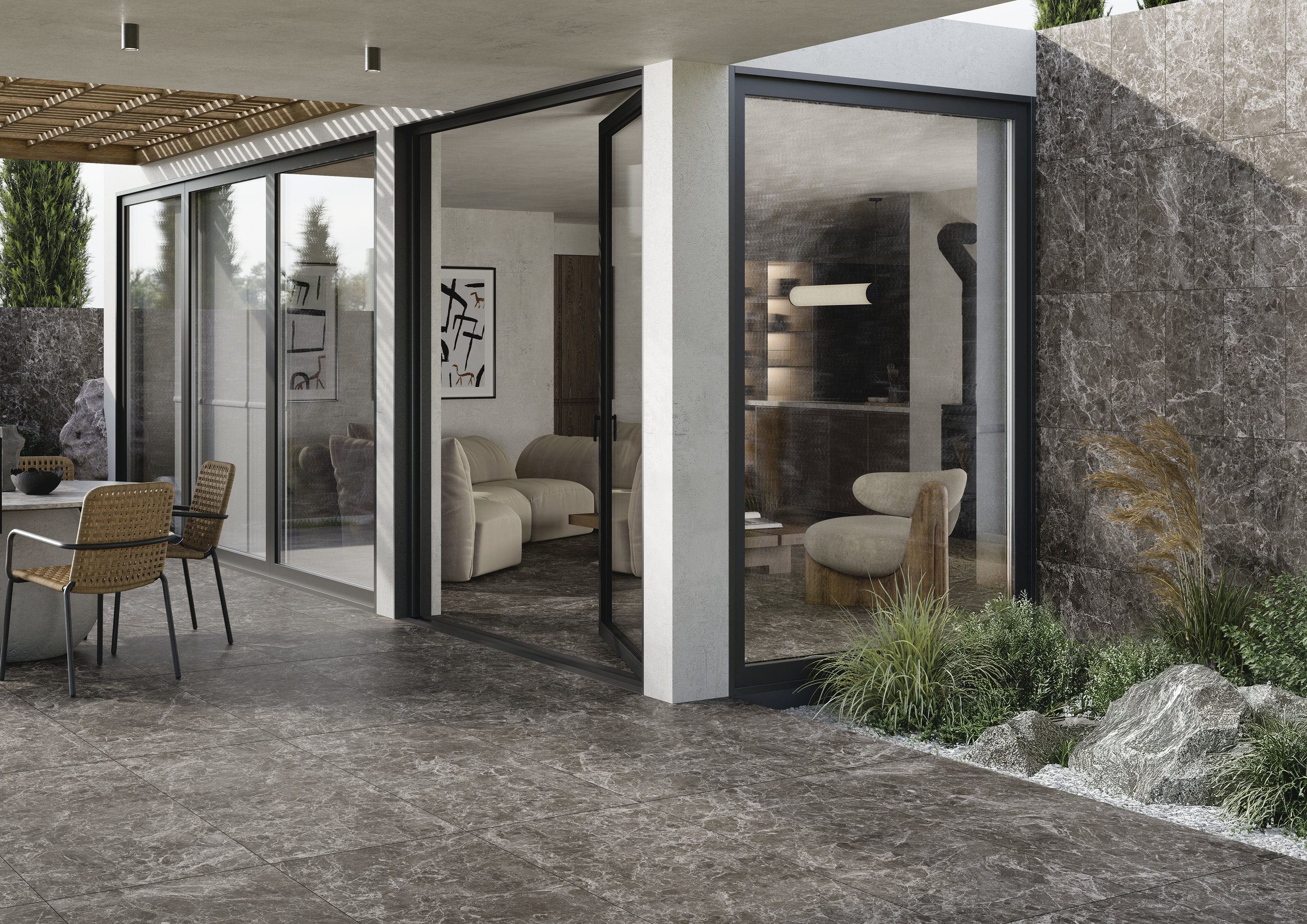 Hochwertige anthrazitfarbene Fliesen verbinden Terrasse und modernen Wohnraum, auch als Wandverkleidung.