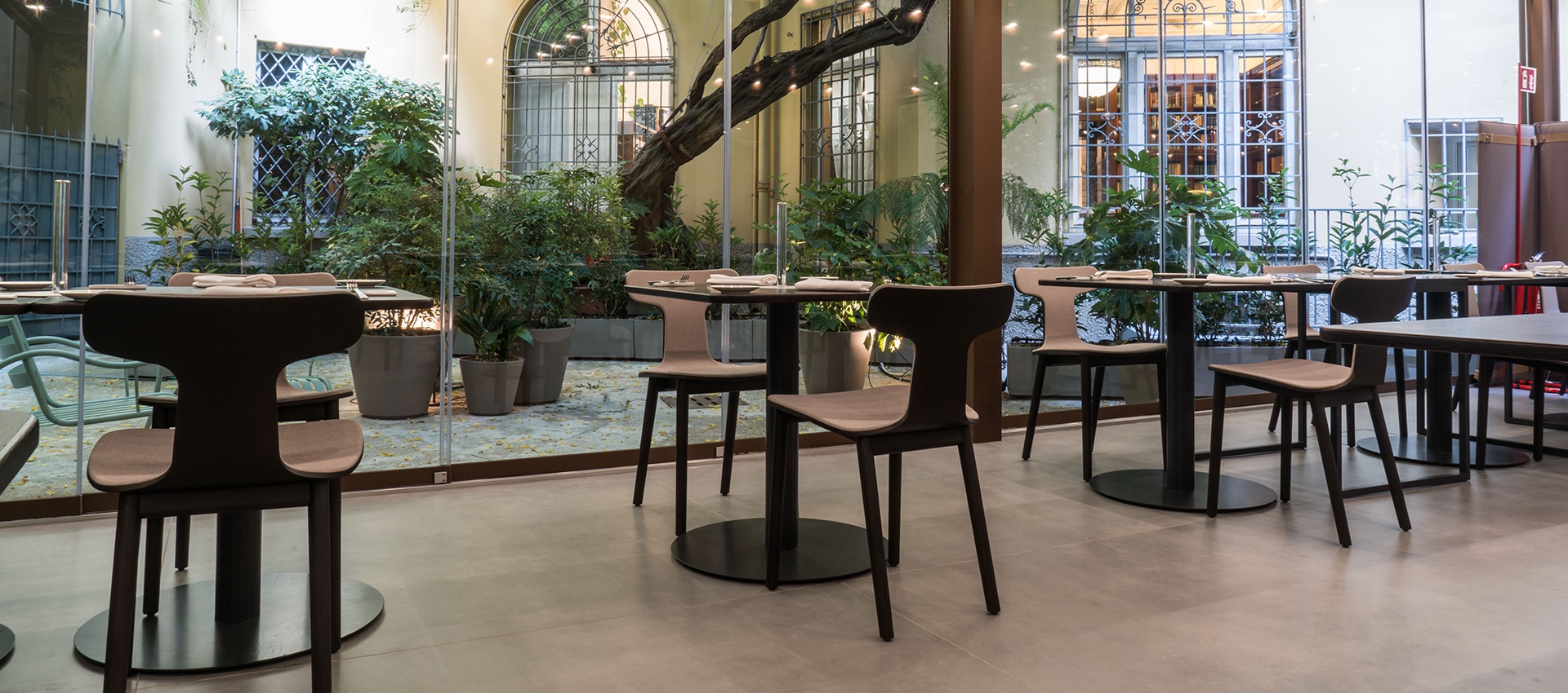 Large-format tiles stylishly connect modern indoor and outdoor spaces.