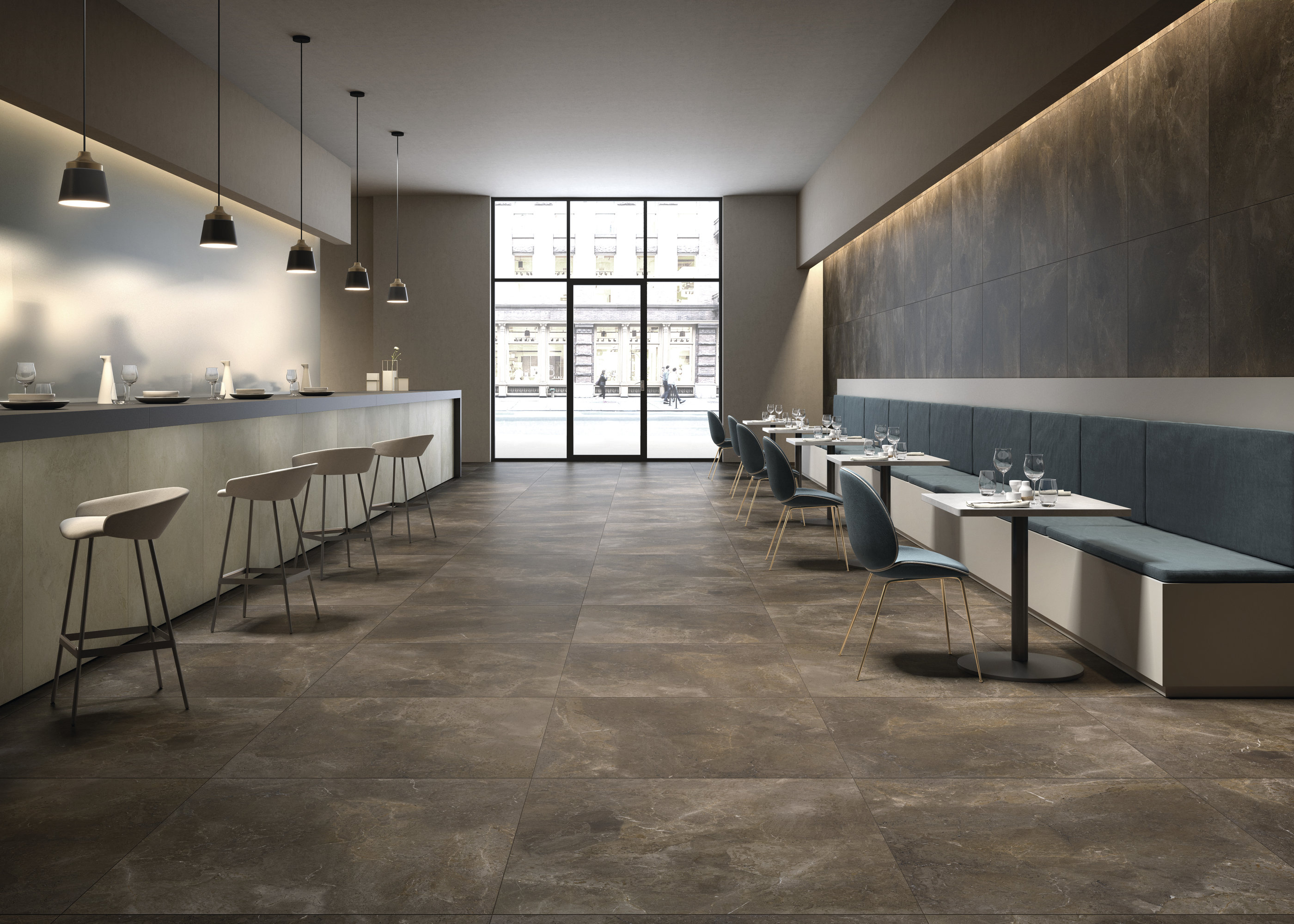 Elegant, large-format floor tiles in a dark tone for modern interiors like restaurants.