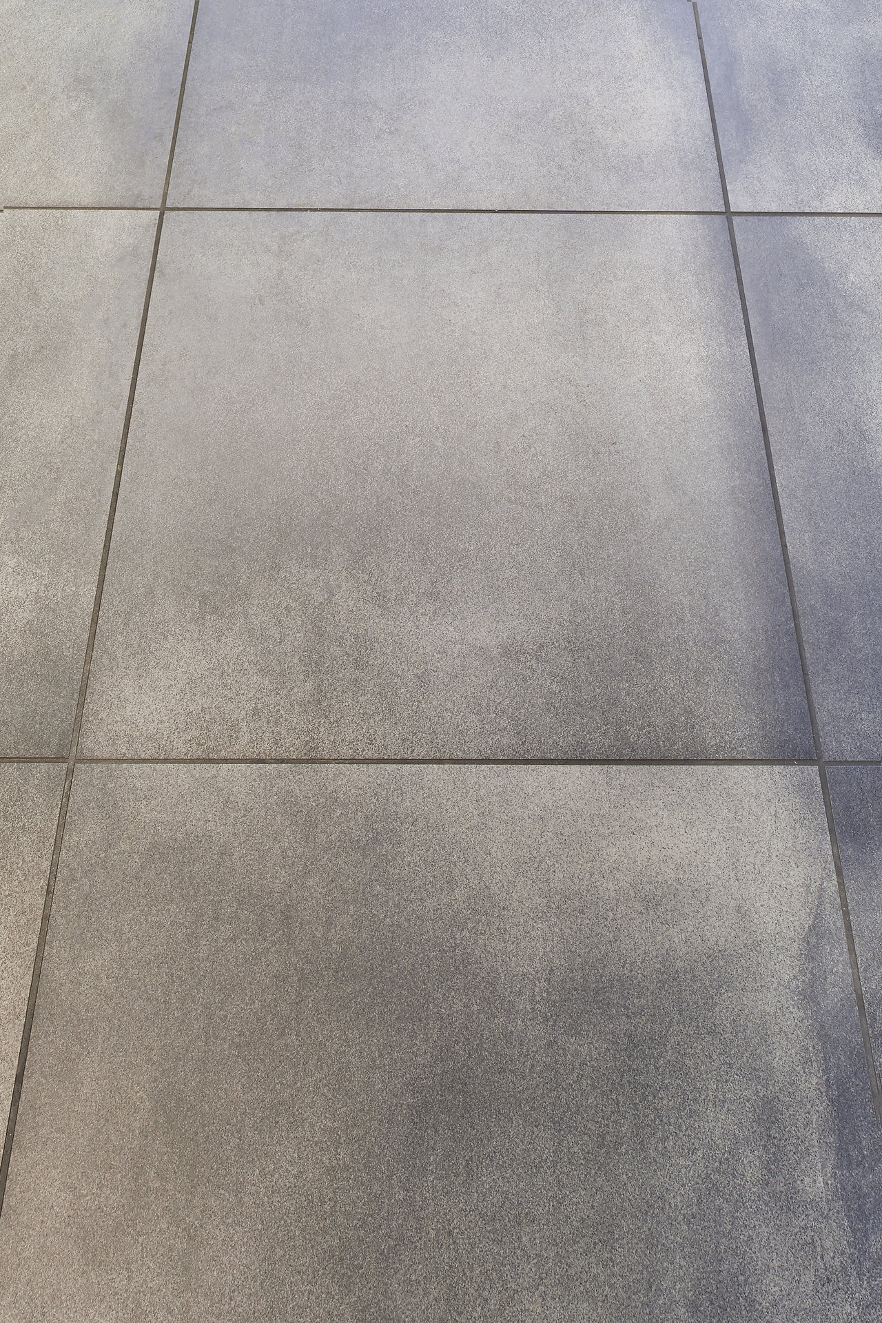 Modern grey concrete-effect tiles for stylish indoor and outdoor areas.