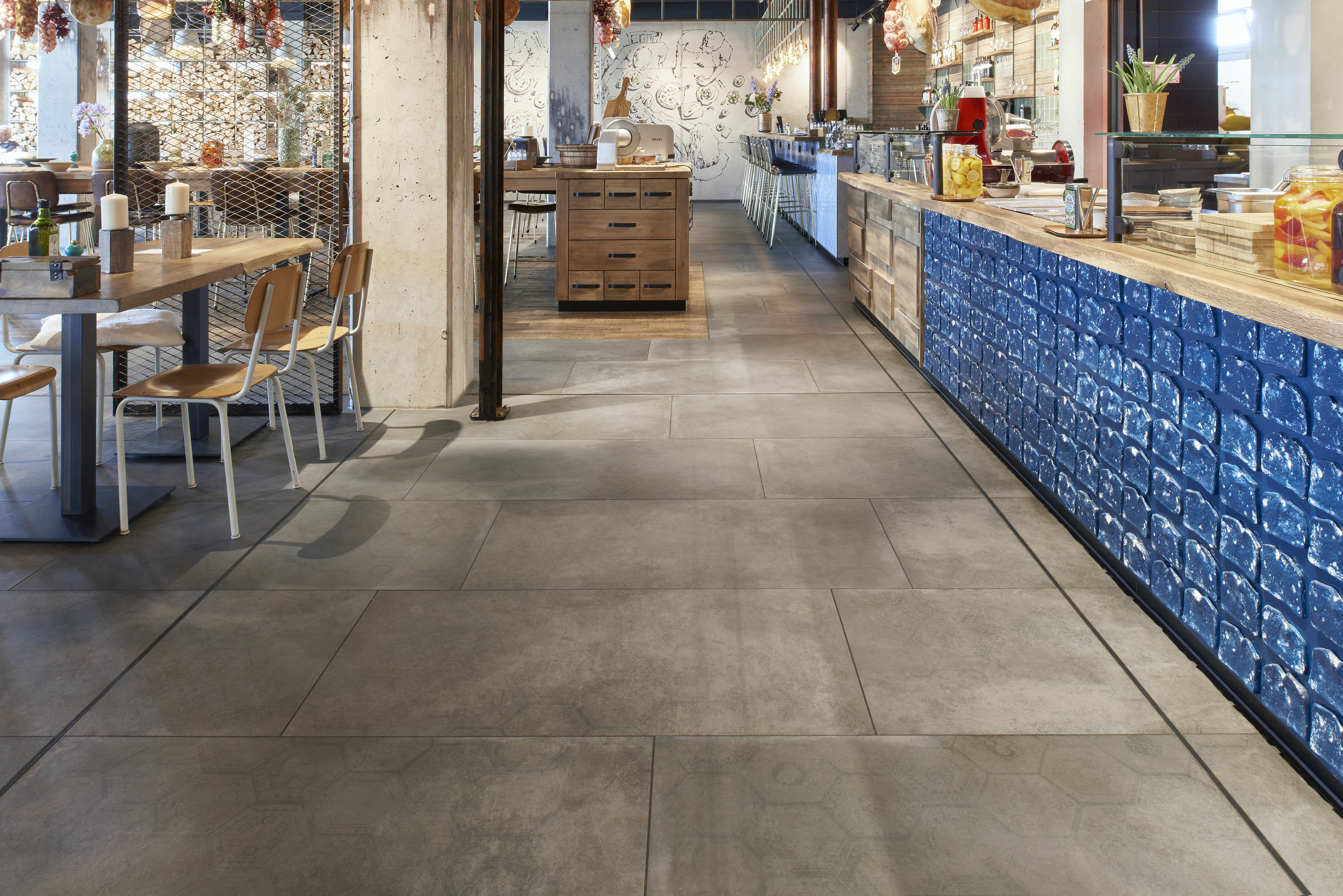 Large-format grey concrete-effect tiles for modern interiors.