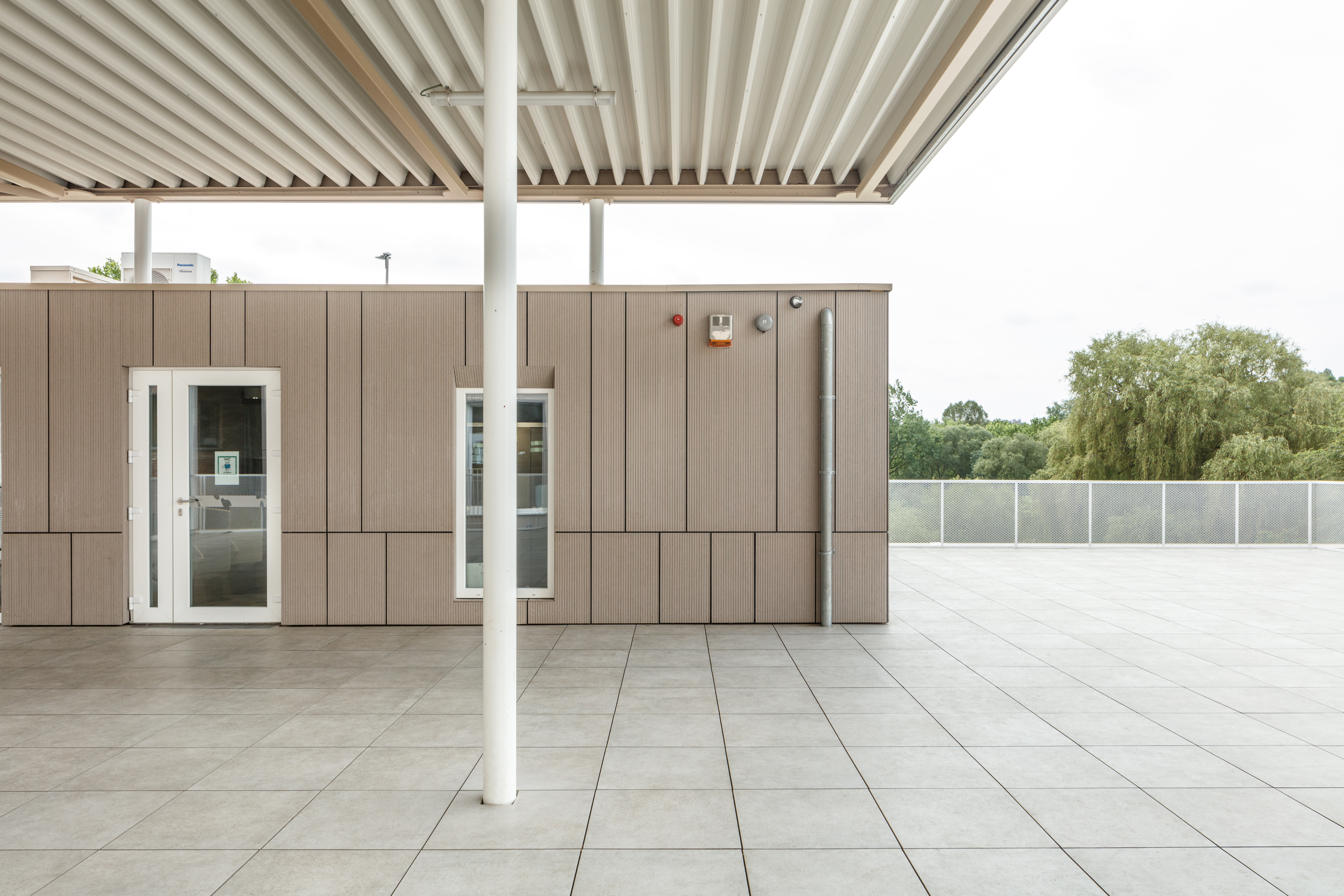 Timeless, grey patio tiles under a canopy, ideal for outdoor use.