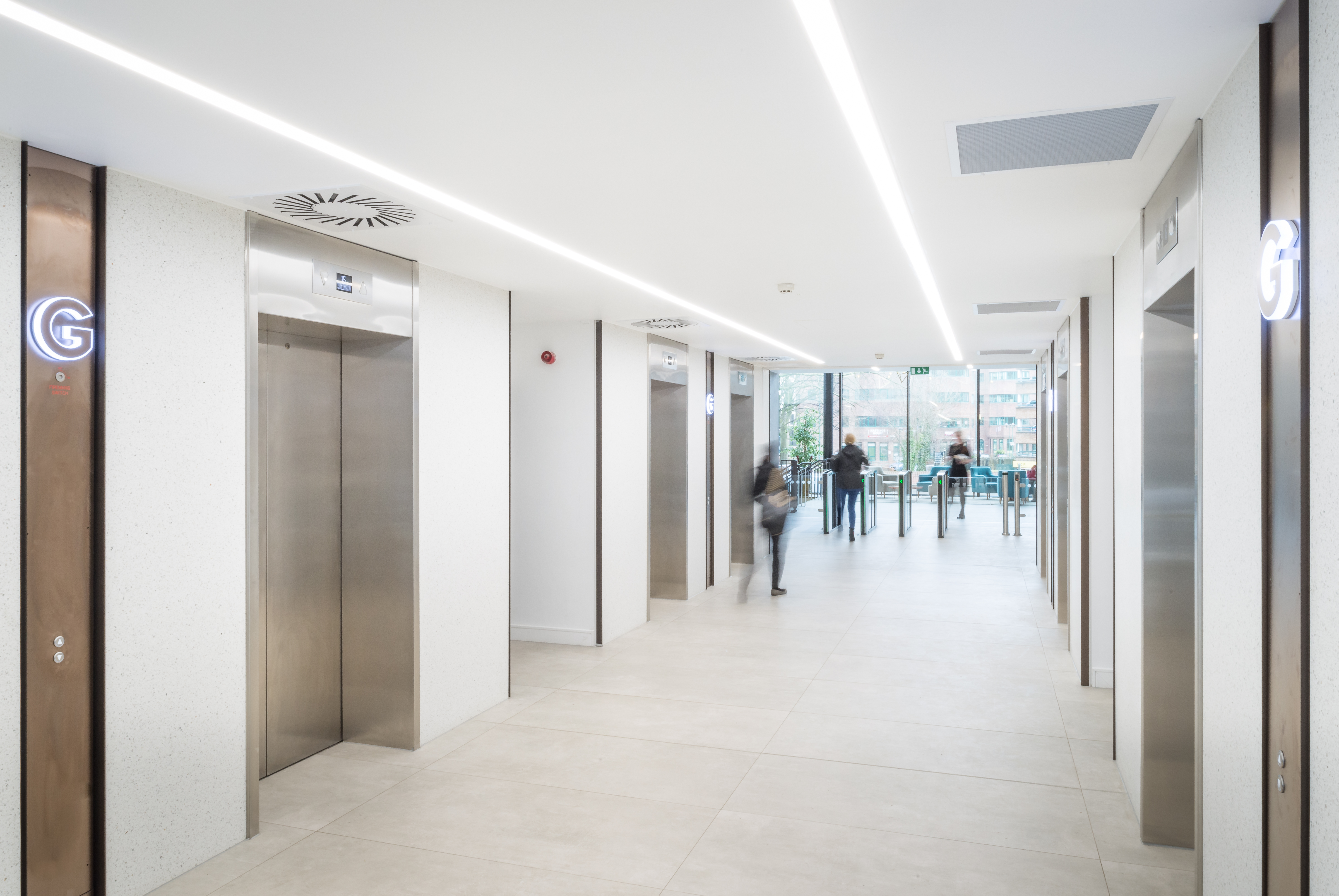 High-quality, bright tiles in a modern lift area.