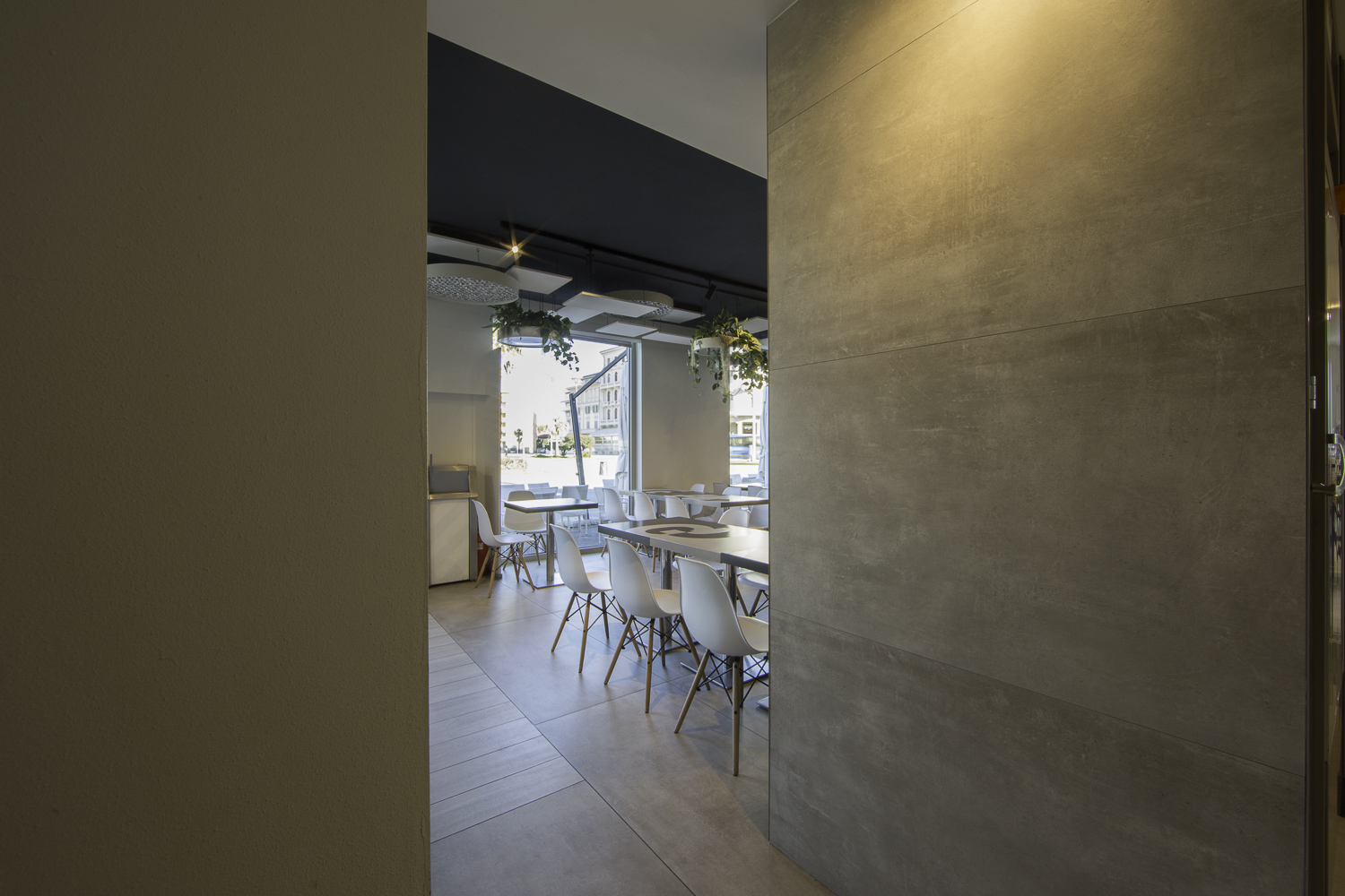 Modern grey tiles on wall and floor in a stylish interior.