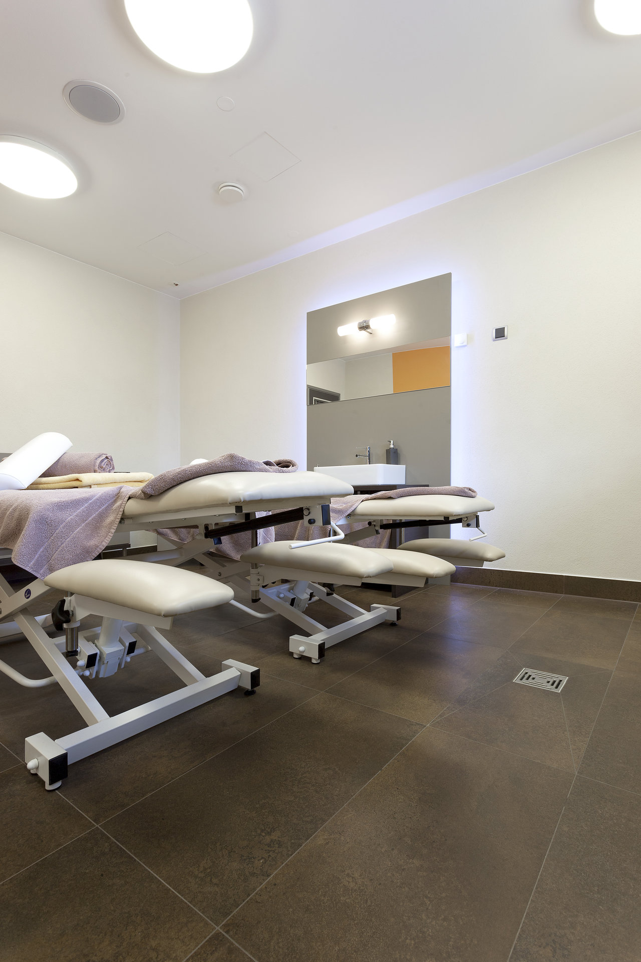Premium dark brown tiles for wellness areas.