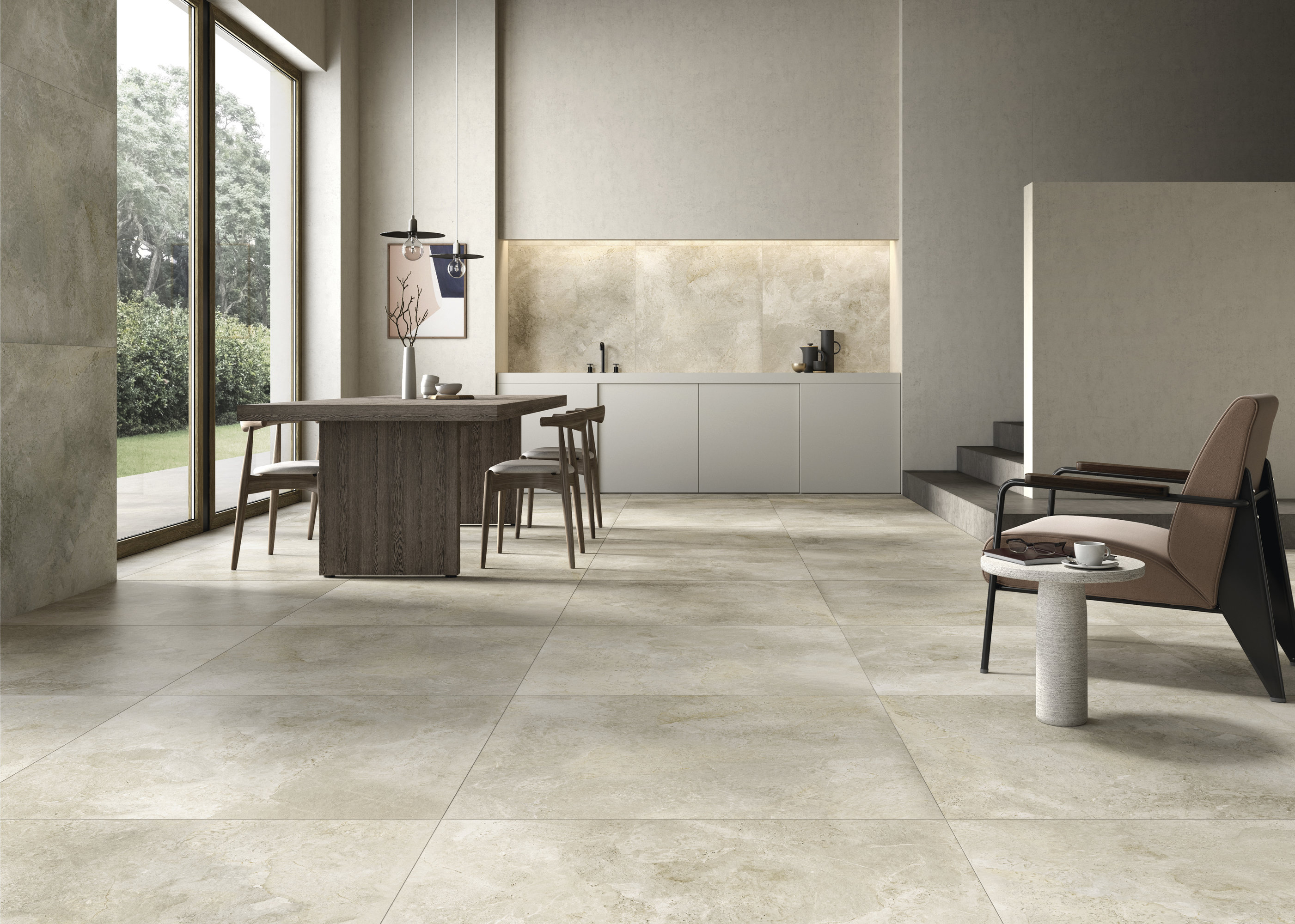Premium large format light grey floor tiles in a modern open-plan living space.