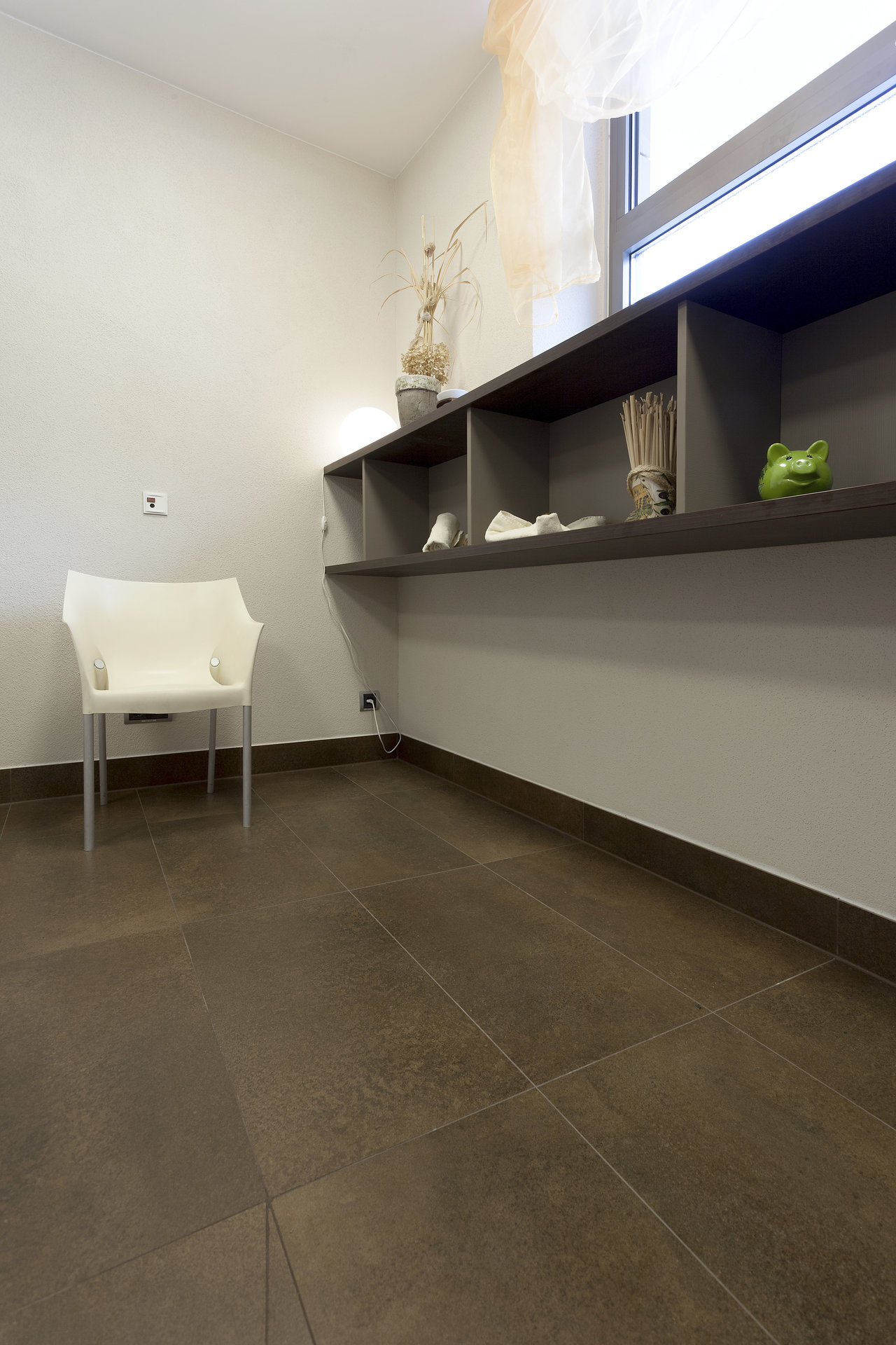 High-quality dark brown indoor tiles in a modern setting.