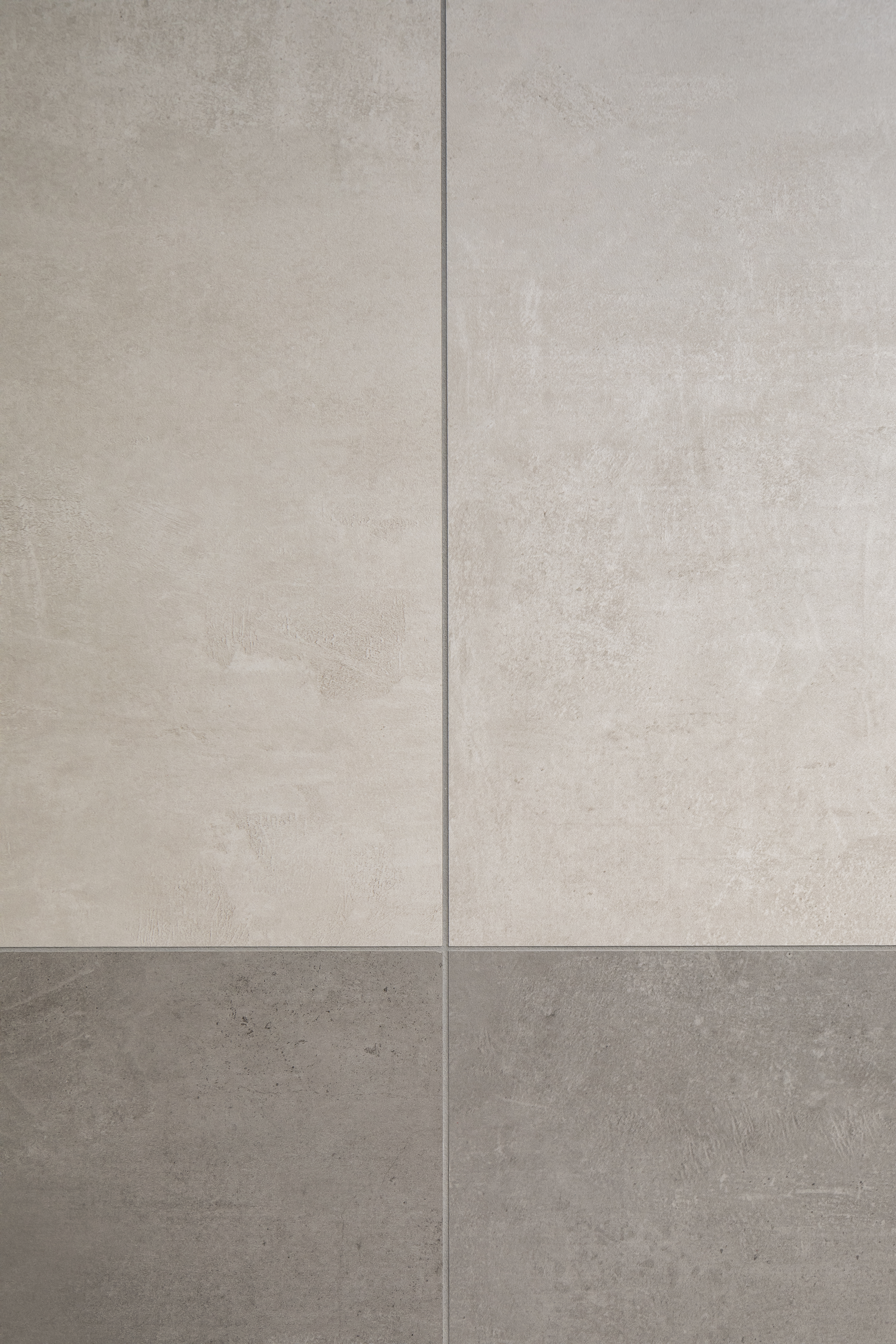 Concrete-look tiles in light and dark grey for modern indoor and outdoor areas.