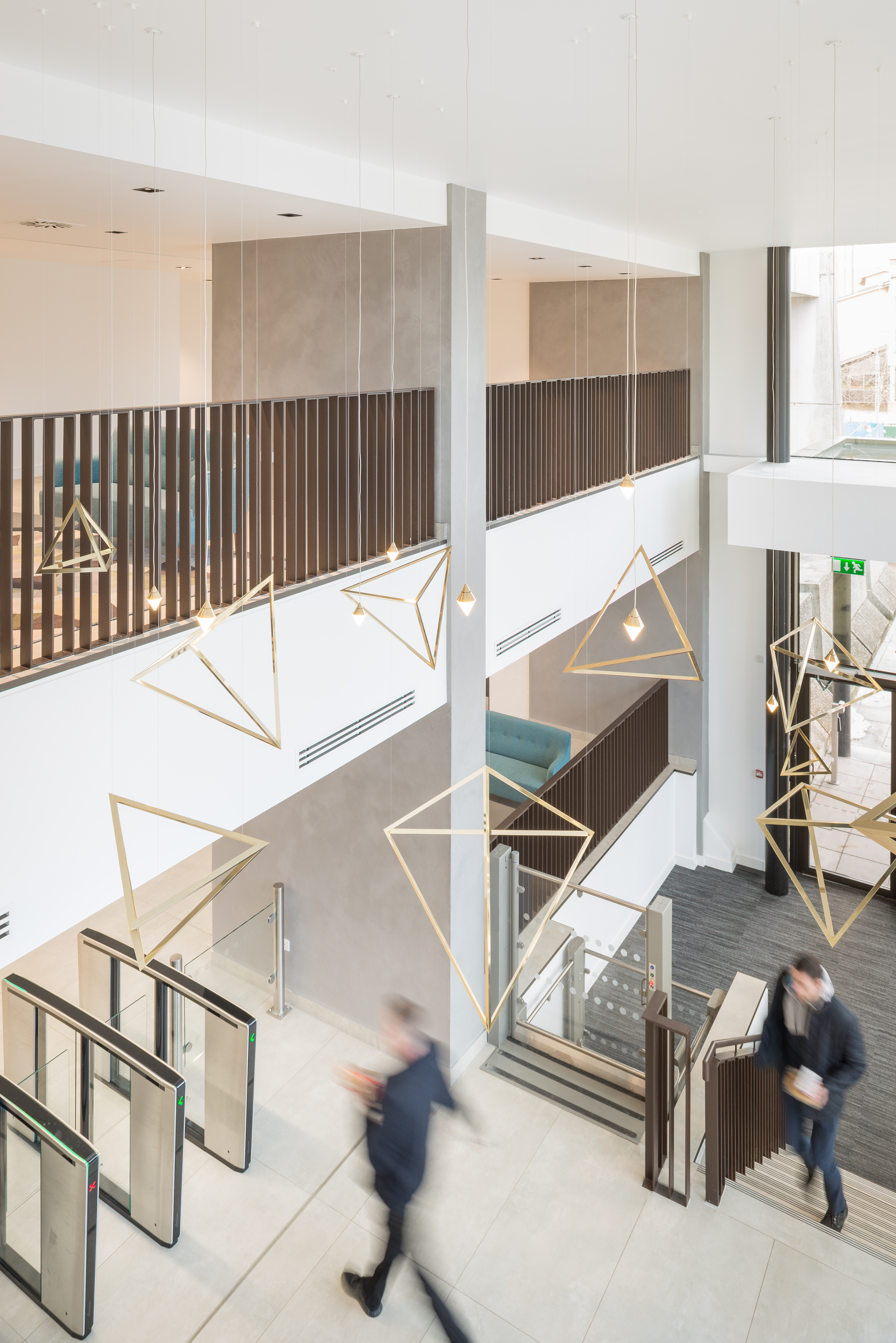 Bright, modern reception area with large-format floor tiles and stylish design elements.