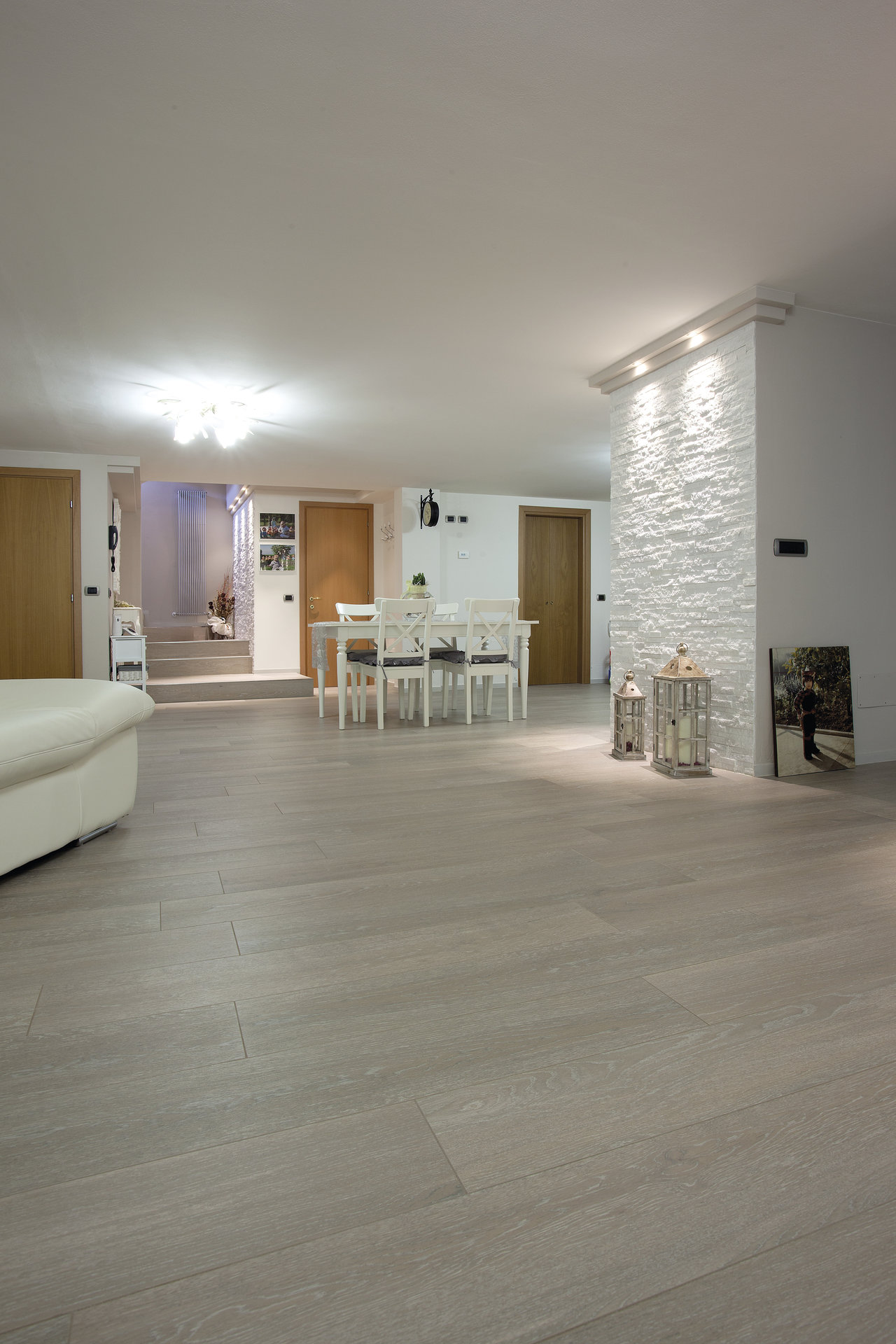 Stylish light grey tiles for open-plan living and dining.